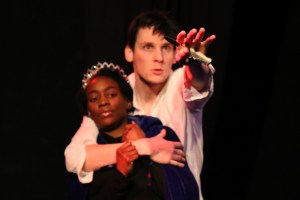 Daniel Morris (the Peasant) roughly grabbing Hannah Omisore (the Princess) and thrusting a knife towards the viewer