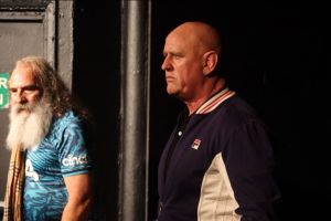 Standing on the left in a blue multi-coloured football shirt and Burberry style checked scarf Daisy Boy (played by Jud Charlton) and standing on the right Danny Boy (played by Francis Saunders) in a blue and cream Fila jacket.